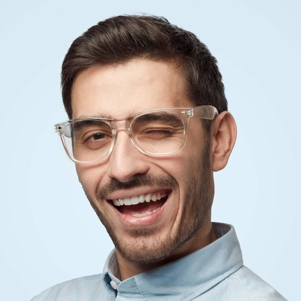 young-trendy-man-winking-with-smile-as-if-having